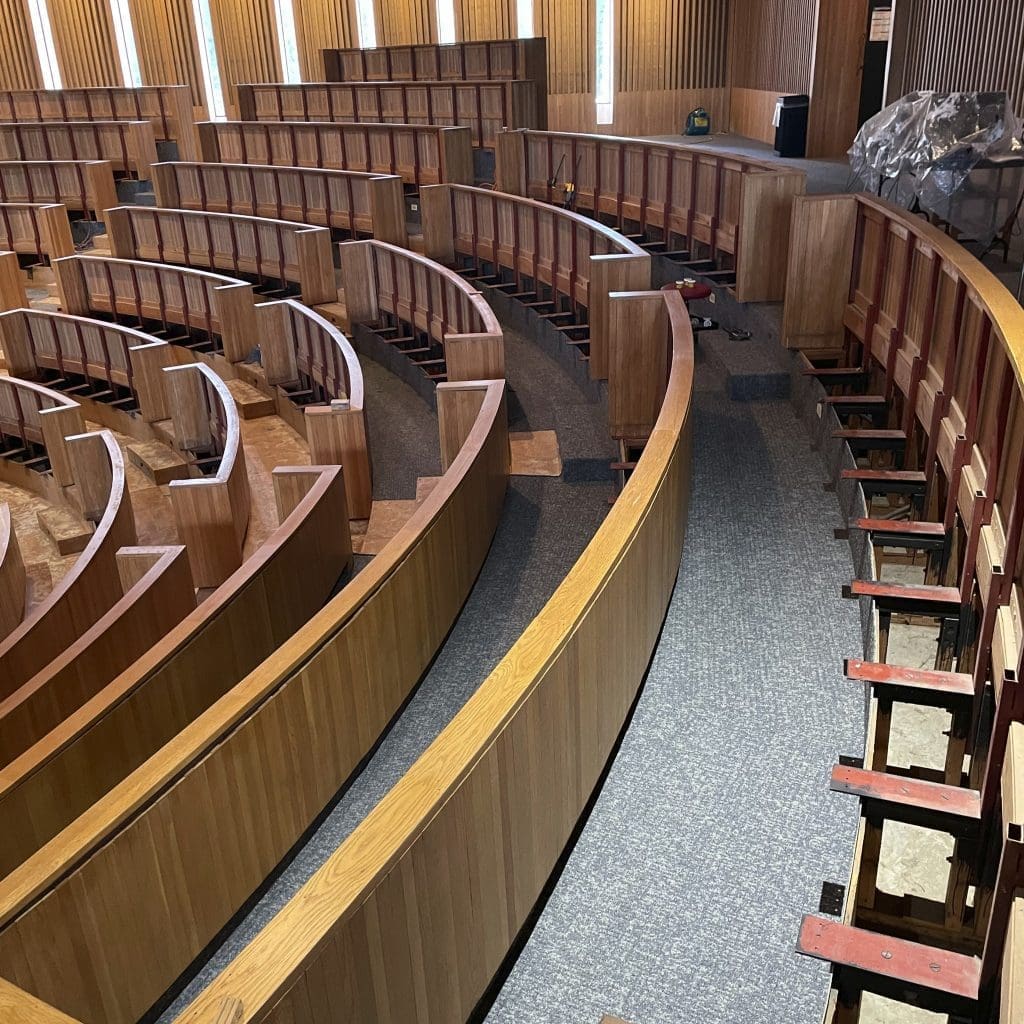 seats awaiting new seat cushions ini Shelton auditorium.